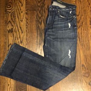 Distressed blue jeans